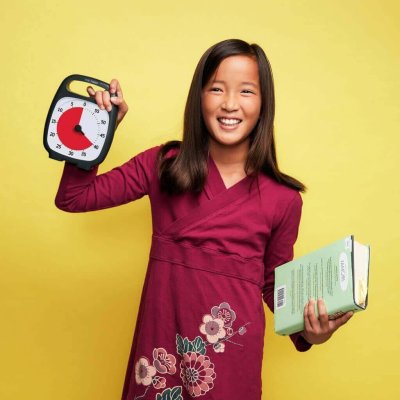 Girl holding a Time Timer PLUS